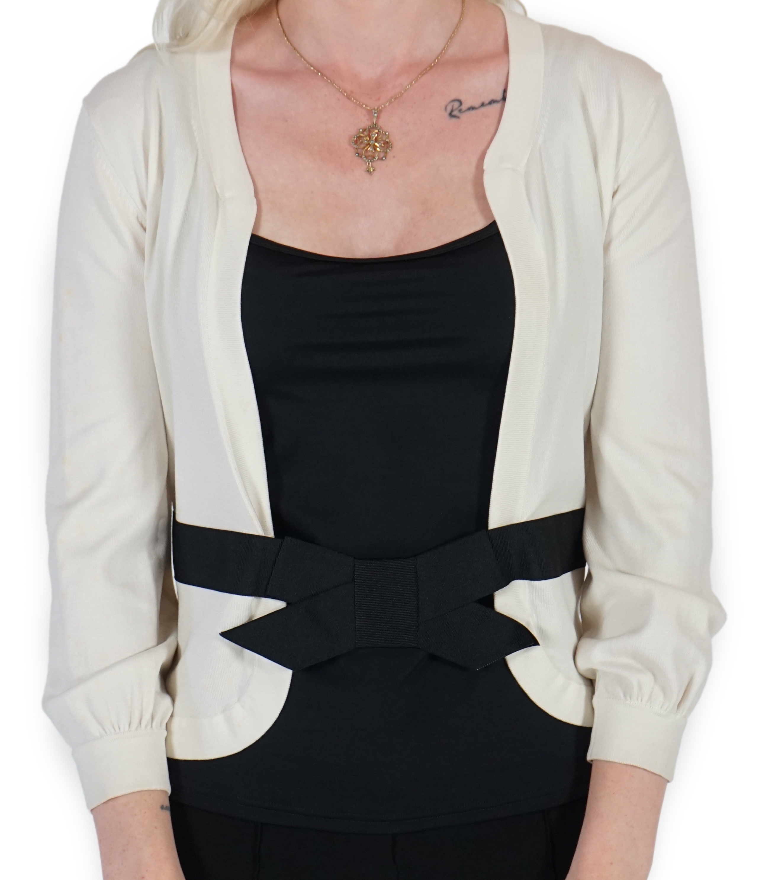 A white Valentino jacket with black camisole
